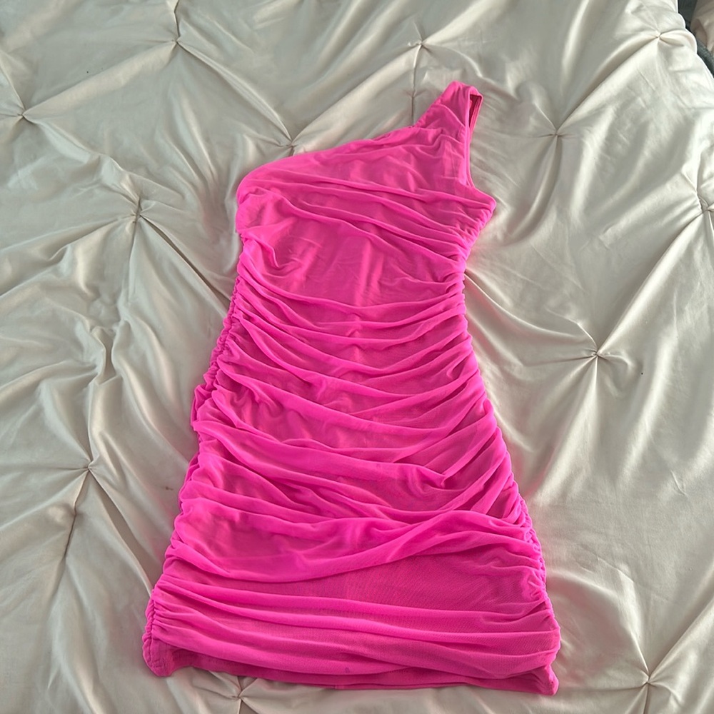 Hot pink one shoulder dress.